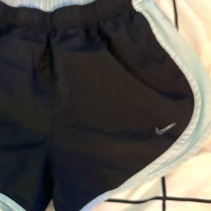black and light blue nike shorts